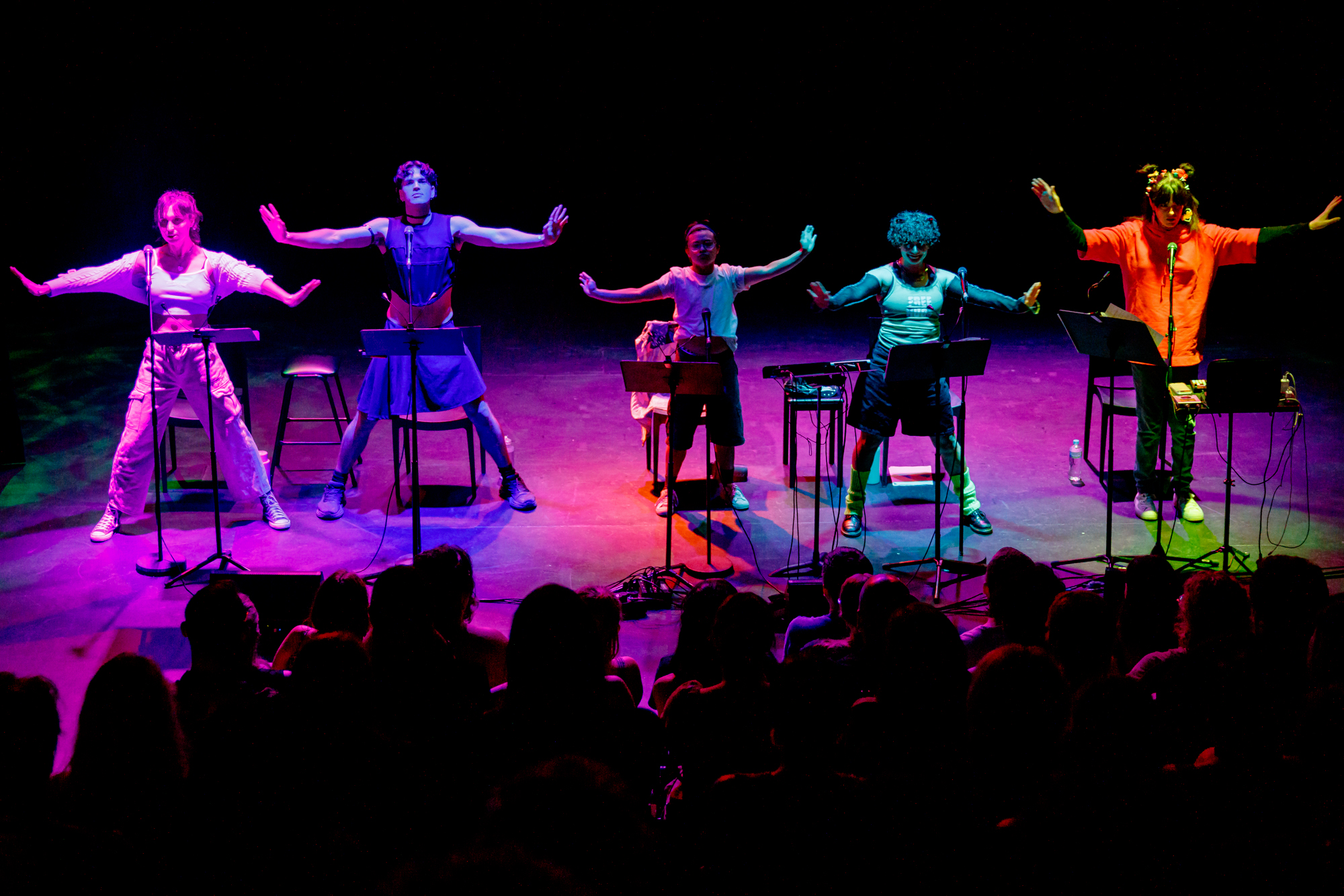 The cast dancing together during the 2025 concert of A Transgender Woman on the Internet, Crying
